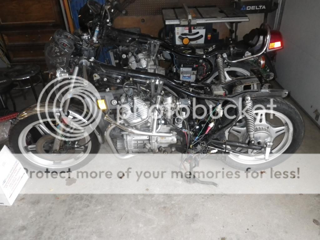 ... a hacked up wiring harness and two bent wheels, 2into1 exhaust and drag bars, the other I was told lost the timing chain. Neither of which had any body ...